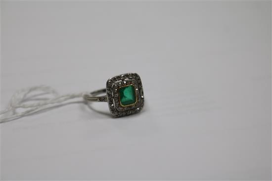 A white metal, emerald and diamond tablet cluster ring, size K.